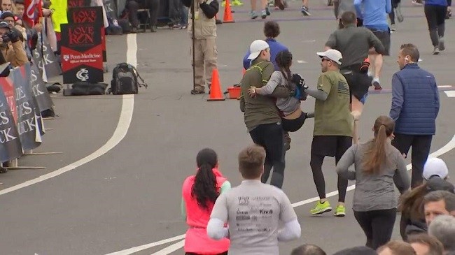 Man helping carrying girl